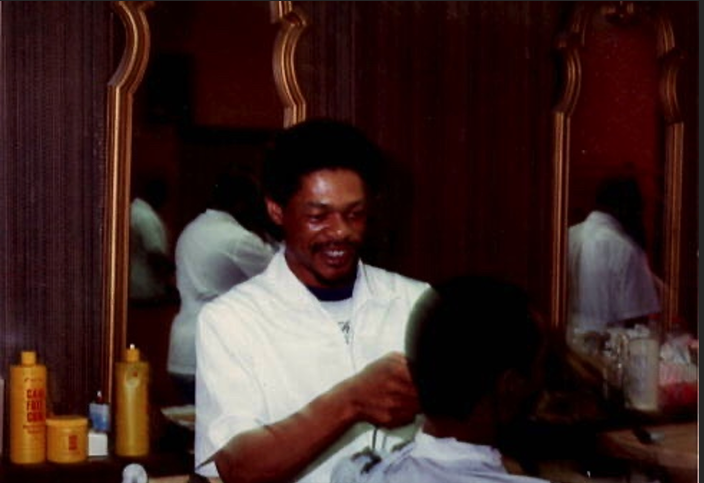 Naim Sabree cutting a client's hair