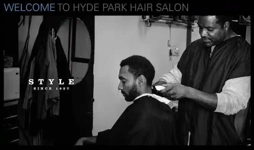 A master barber giving a haircut at Hyde Park Hair Salon