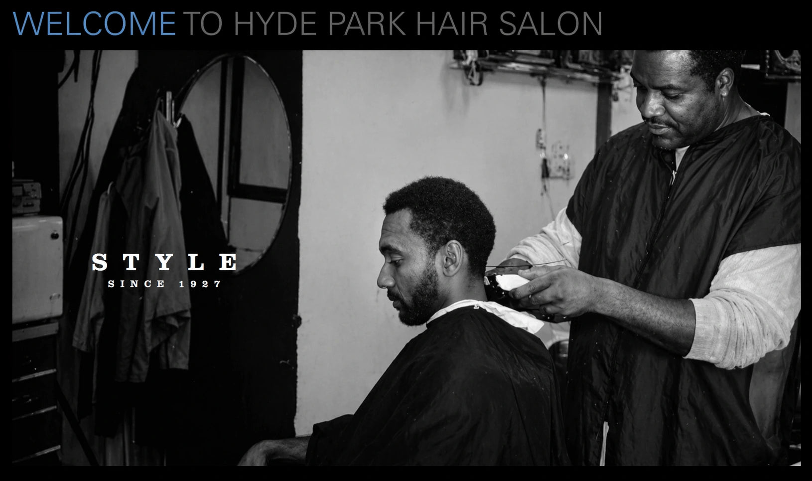 A master barber giving a haircut at Hyde Park Hair Salon